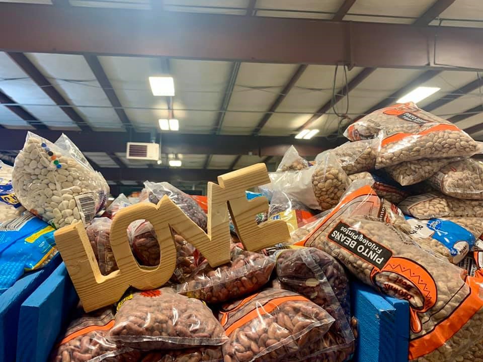 Hand-made Love sign sitting on food supplies